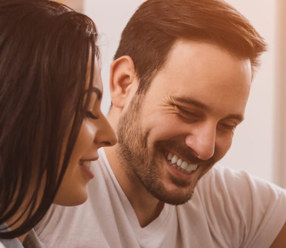 Couple looking at a tablet in their hands